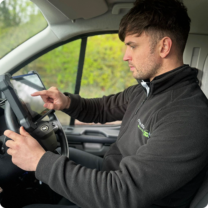 A technician in a Ford Transit using a screen for ford shared ignition barrel parts